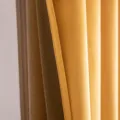 Close-up of mustard yellow and bronze velvet blackout curtain with hook top design - Orange & Yellow
