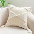 Cream velvet tufted throw pillow cover with tassels displayed on a sherpa chair - 45x45cm / Ivory