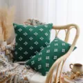 Dark green cotton pillowcases with blue tufted star patterns on a rattan chair - Green