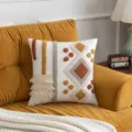 Bohemian tufted throw pillow cover with geometric patterns and tassels on a sofa - Faraway