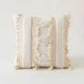 Bohemian cream textured throw pillow cover with decorative tassels and fringe details. - Three Vertical Circles