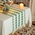 Elegant woven cotton linen table runner with green geometric patterns and boho tassels - 30x200cm / Green