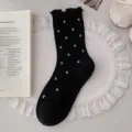 Elegant black cotton socks with small floral patterns and ruffled edges for women - One Size / Black