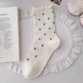 Elegant white mesh cotton crew socks for women with fresh floral print and ruffled cuffs - One Size / Cream