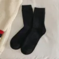 Solid black mid-calf wool socks with fuzzy texture for winter warmth - One Size (EU 33-40) / Black