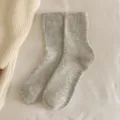 Cozy grey solid color wool socks for women featuring ribbed cuffs and mid-calf length - One Size (EU 33-40) / Grayish White