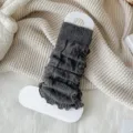 Dark gray cable knit leg warmers with ruffle trim, cozy winter warm Y2K Japanese style socks. - One Size / Carbon Gray
