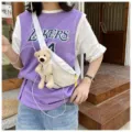 Outdoor street style detail of white canvas chest bag with cute plush bear attachment - White