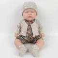 12-inch realistic reborn baby doll wearing a floral romper and grey polka dot cardigan - Sleeping Style (12 Inch H-1033 Small Solid) / 30 cm