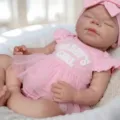Detailed view of 18-inch reborn silicone doll wearing pink Daddy's Girl tutu dress - 45 cm / Pink