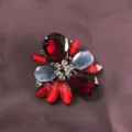 Close-up detail of a vintage Baroque brooch featuring deep red gems and grey stones - Wine Red Floral (B6)