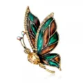 Detailed macro shot of vintage butterfly brooch with green enamel and crystals - Style 7