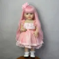 Realistic 22-inch reborn doll featuring long pink hair and a beautiful floral pink party dress - 22 Inch Pink Hair Betty (2189) / 55cm Full Vinyl Version