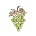 Close-up of a grape-shaped brooch with green pearls and sparkling crystal rhinestones - Green