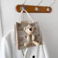 Detailed view of linen tote bag featuring a cute 3D plush bear and printed patterns - 20x20x12 / Milky White