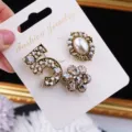 Elegant vintage gold-tone brooch set with number 5, pearl and crystal floral details - 3-Piece Set / Gold