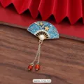 Detailed view of vintage Chinese fan-shaped brooch with blue enamel and pearl tassel. - 352# Flower and Bird Pattern Fan