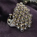 Close-up of a vintage gold peacock brooch inlaid with sparkling rhinestone crystals - Peacock Style (B13)