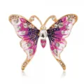 Detailed macro shot of vintage butterfly brooch with purple enamel and crystal accents. - Style 12