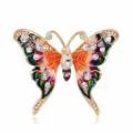 Close-up of a vintage butterfly brooch featuring colorful enamel and inlaid crystals - Style 13