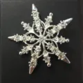Silver-toned snowflake brooch with sparkling rhinestones in a vintage baroque style - Snowflake Style (B15)