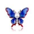 Elegant vintage butterfly brooch featuring blue enamel wings and a large center pearl - Faux Pearl / Style 20