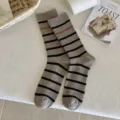 Cozy gray and black striped cotton crew socks for women in lifestyle setting - One Size / Light Coffee