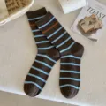 Cozy brown mid-calf socks featuring blue and orange stripes in a trendy casual style - One Size / Dark Coffee