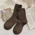 Cozy dark brown speckled wool socks with vertical ribbing texture on white fleece background - One Size / Dark Coffee