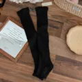 Classic black ribbed over-the-knee leg warmers with a cozy vintage knit texture - One Size / Black