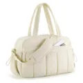 Close-up of large beige quilted travel bag with shoulder strap and side storage pocket - Off White