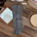 Grey ribbed stirrup leg warmers with heel opening for women on wood background - One Size / Medium Grey