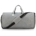 Macro view showing the texture and design of this grey large capacity foldable suit travel bag - With Leather Label / Gray
