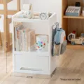 White movable multi-layer plastic storage cart with bottom drawer, size 42x28.5x61 cm. - Triple Layer / Non-Wheeled Style (With Bag Hook) / White