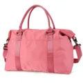 Side view of a durable pink travel duffel bag with reinforced handles and strap. - Watermelon red
