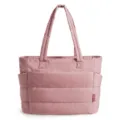 Detail view of pink quilted tote bag featuring side pockets and top handles - Pink