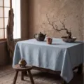 Minimalist light blue washed cotton tablecloth featuring a natural linen texture for home - Custom Size / Grey Blue