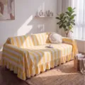 Yellow and white striped velvet sofa cover with ruffled edges in a sunny living room - 132-180cm / Yellow White Stripes