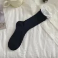 Close-up of black and white layered crew socks with double ribbed cuffs, breathable thin style. - One Size / Black