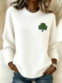 Close-up detail of white knit crew neck sweater with green shamrock clover embroidery - S / Tops / Cream Single Clover (TBL773778)