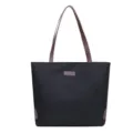Bolso tote minimalista de lona negra con correas marrones y gran capacidad interior. - Negro