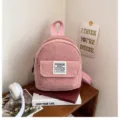 Fashionable pink corduroy mini backpack for women, perfect for casual outdoor travel. - Pink