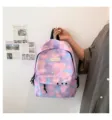 Close-up of a pastel cloud-patterned school backpack with stars and decorative metal chain - Purple