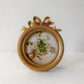 European retro gold resin round photo frame with bow detail and floral art print for home decor - Style C (JY-0015) / Inner 10x10cm Outer 13x15cm