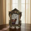 Detailed close-up of a vintage retro resin photo frame with ornate gold carved border on table. - Inner Diameter 5.5*7.5, Outer Diameter 9*13 cm