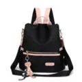 Close-up detail of black Oxford cloth women's backpack featuring a cute cat charm - Black without Pendant