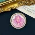 Close-up detail of a vintage pink angel cameo brooch with iridescent rhinestones - Pink Angel Cameo / Pink