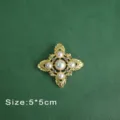 Close-up of a vintage Baroque style brooch with pearls and crystals on green background. - Cross Star Pearl Style (B1)