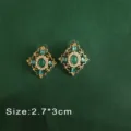 Detail of vintage Baroque emerald green gemstone earrings with pearl accents. - Emerald Pearl Style (E4)