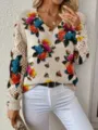 Detail view of bohemian floral V-neck knit sweater with elegant hollow out sleeves - S / Top (VT5)